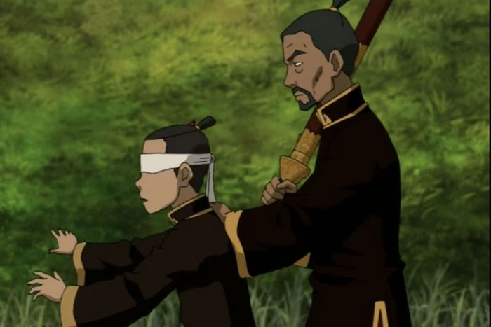 An image of a teenager (Sokka, from Avatar), blindfolded, with a man with his hand on his back. The man holds a sheathed sword